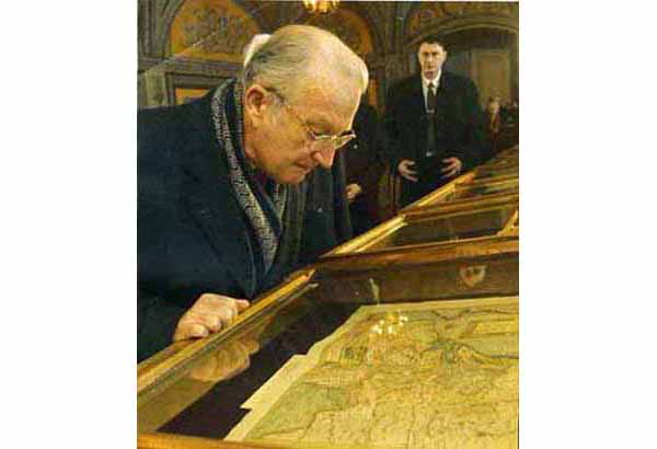 King Albert II of Belgium studying an antique map